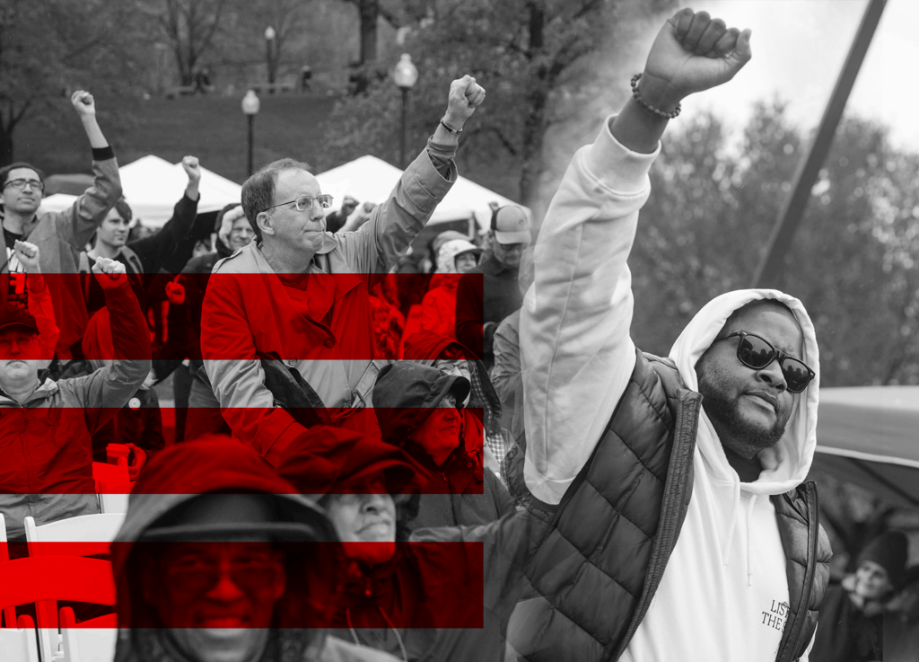 Black and white photograph of people with raised fists at an outdoor gathering, with 3 red stripes overlaid across the image