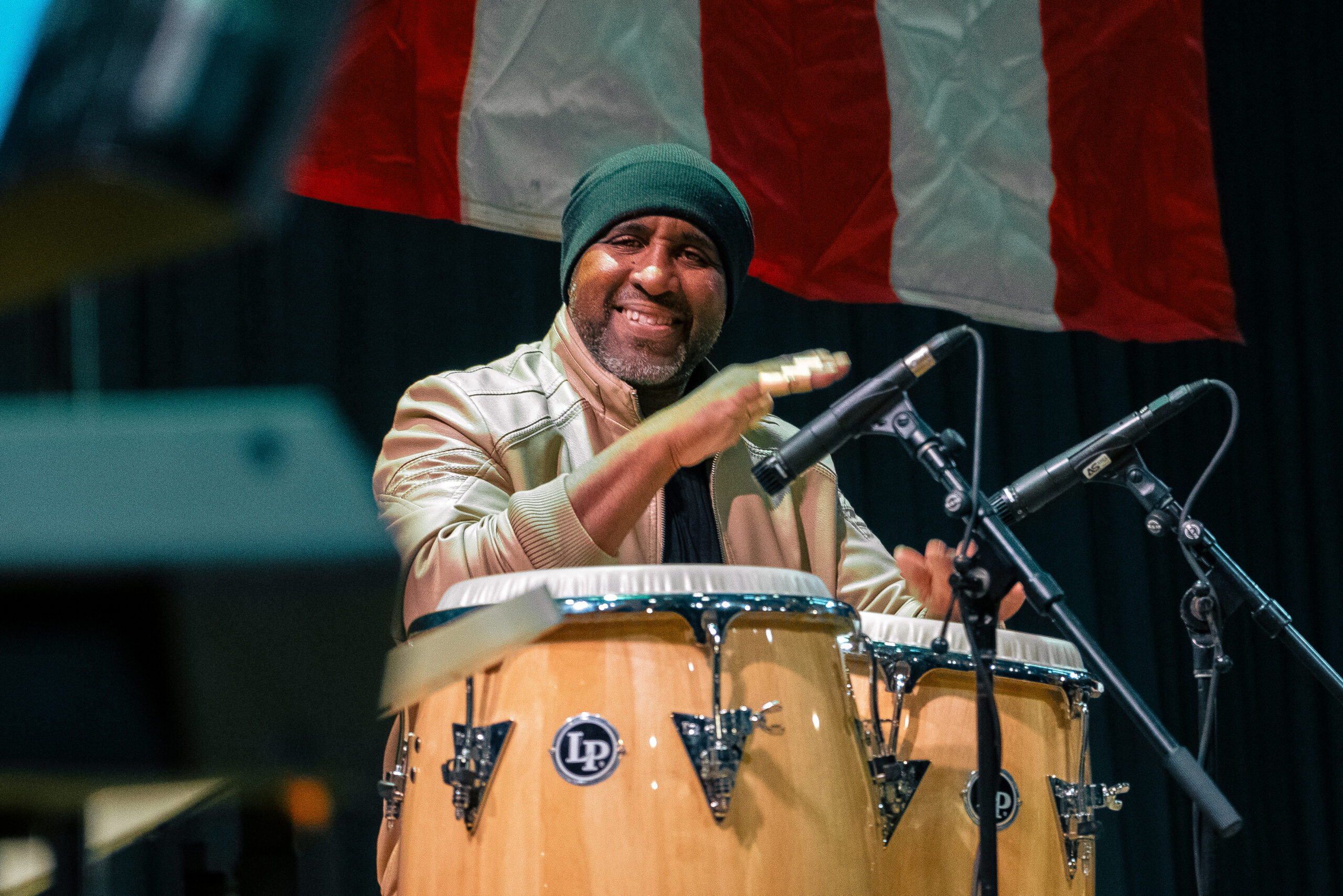 A person playing conga drums